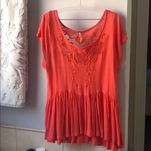 Orange free people shirt with sheer cutout detail